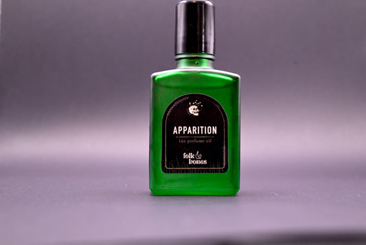 Folk and Bones Apparition 1 oz perfume oil candle with dark wax and mystical design, ideal for aromatic ambiance and spiritual ambiance.