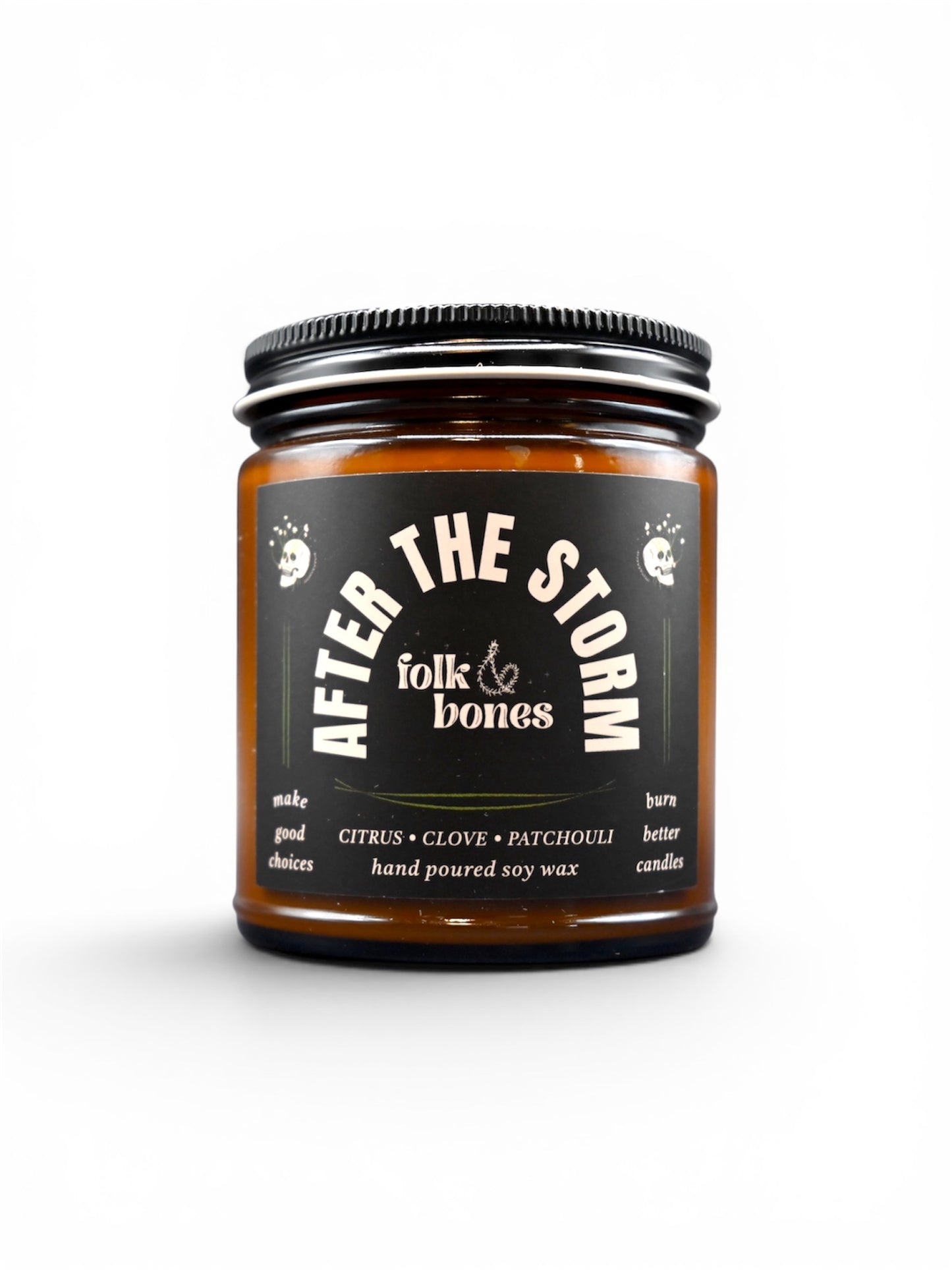 Folk and Bones After the Storm 8 oz soy candle in a glass jar with a natural, rustic label and a wick ready for lighting.