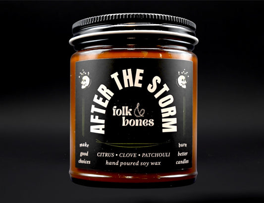 Folk and Bones After the Storm 8 oz soy candle with a rustic jar and natural wax, perfect for cozy home ambiance.
