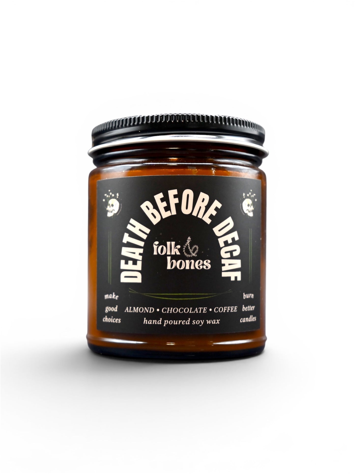 Folk and Bones Death Before Decaf soy candle in an 8 oz glass jar with a lit wick and minimalist label design.