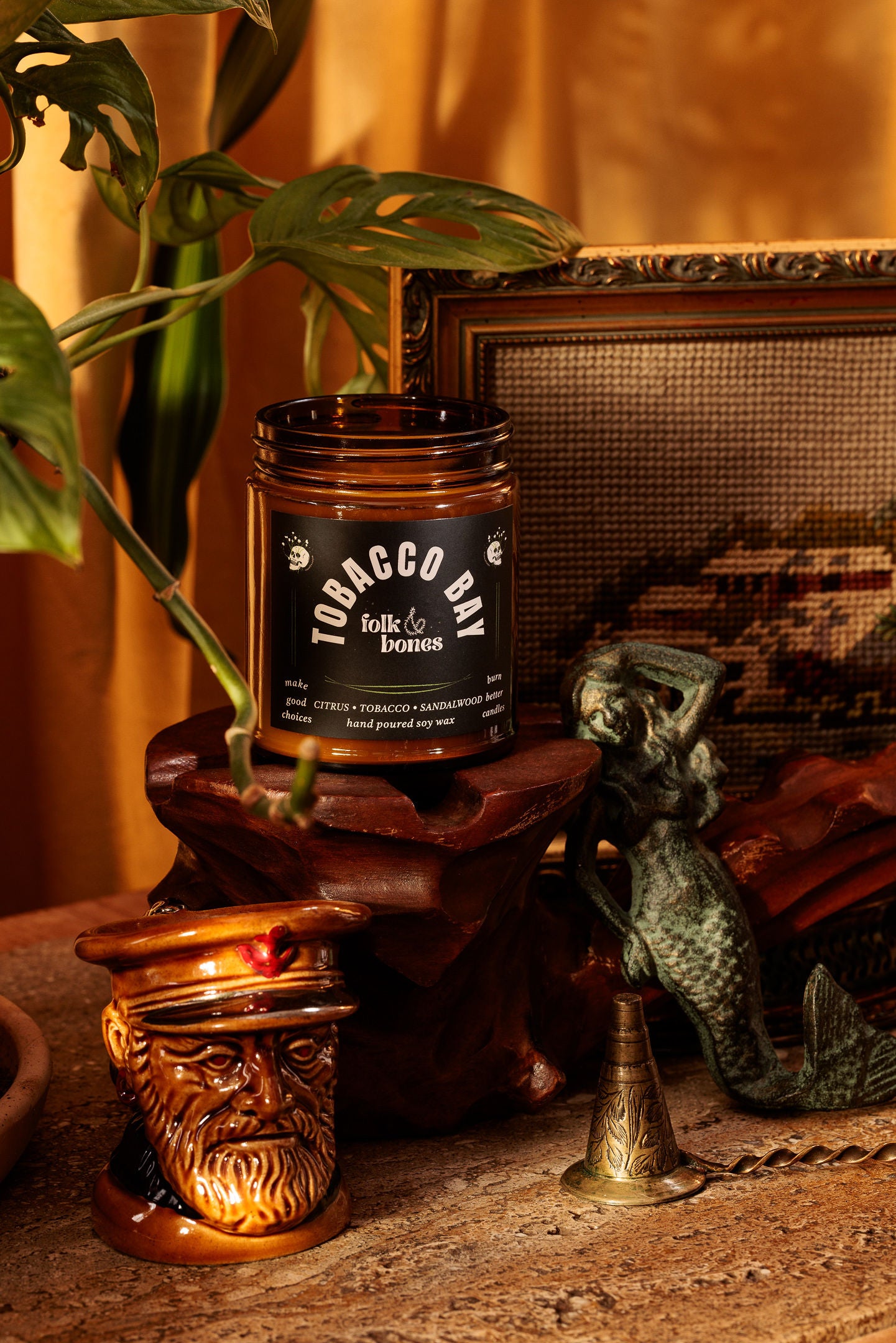 Folk and Bones Tobacco Bay 8 oz soy candle with a rustic jar and natural wax, ideal for home fragrance and cozy ambiance.