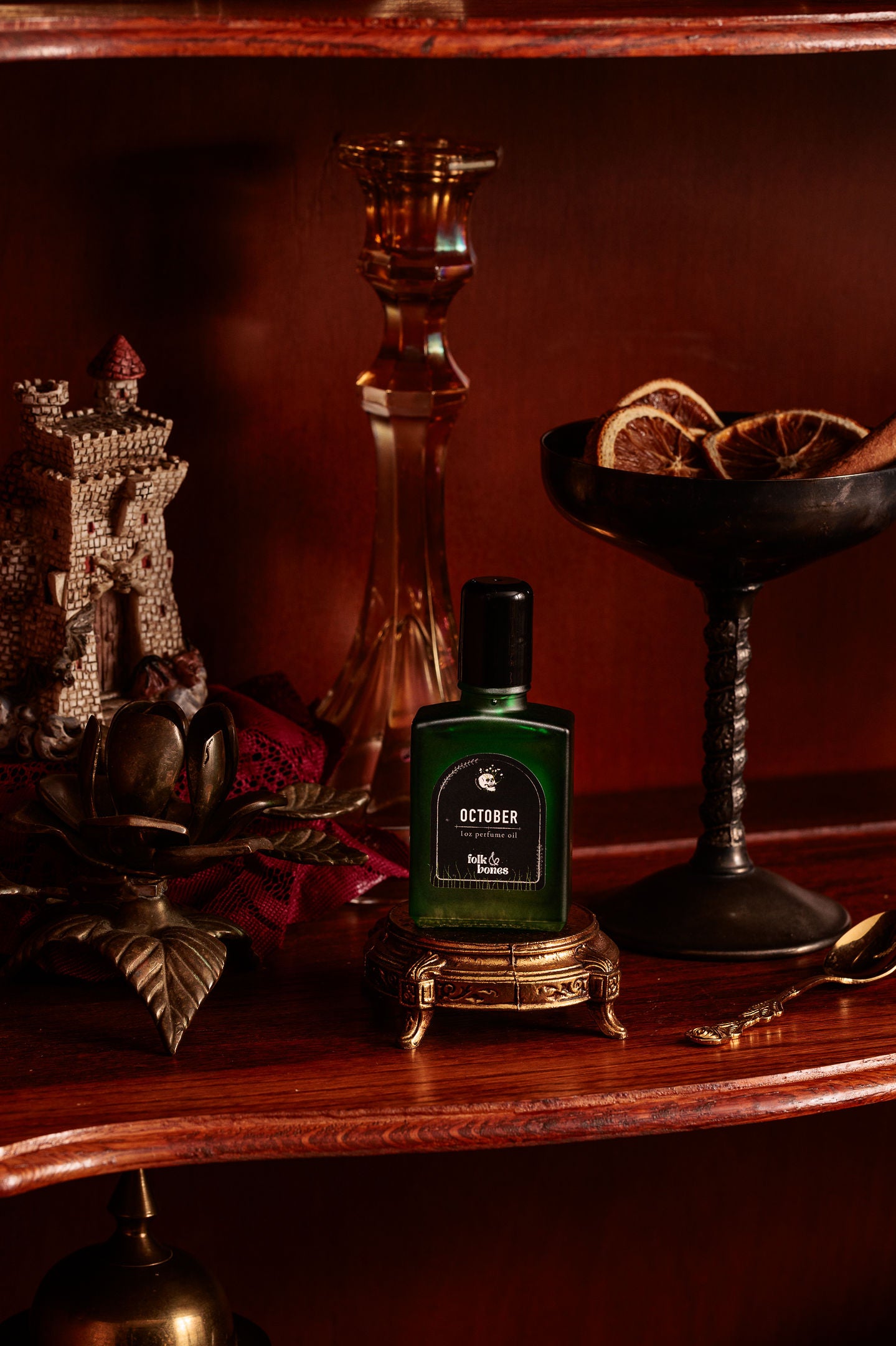 Folk and Bones October 1 oz perfume oil candle with a sleek black container and minimalist label design.