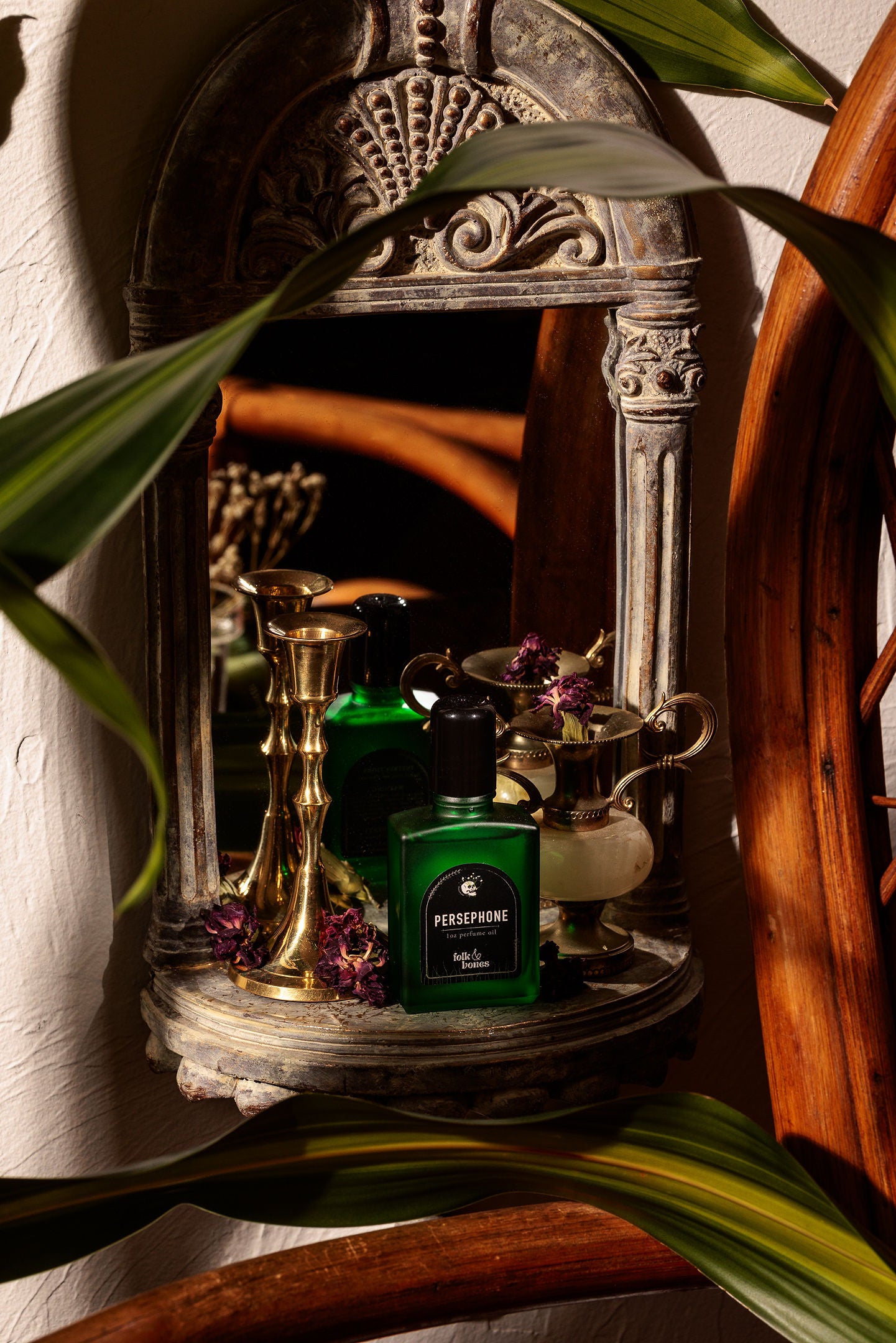 Folk and Bones Persephone 1 oz perfume oil bottle with elegant packaging, showcasing the fragrance's design and branding.