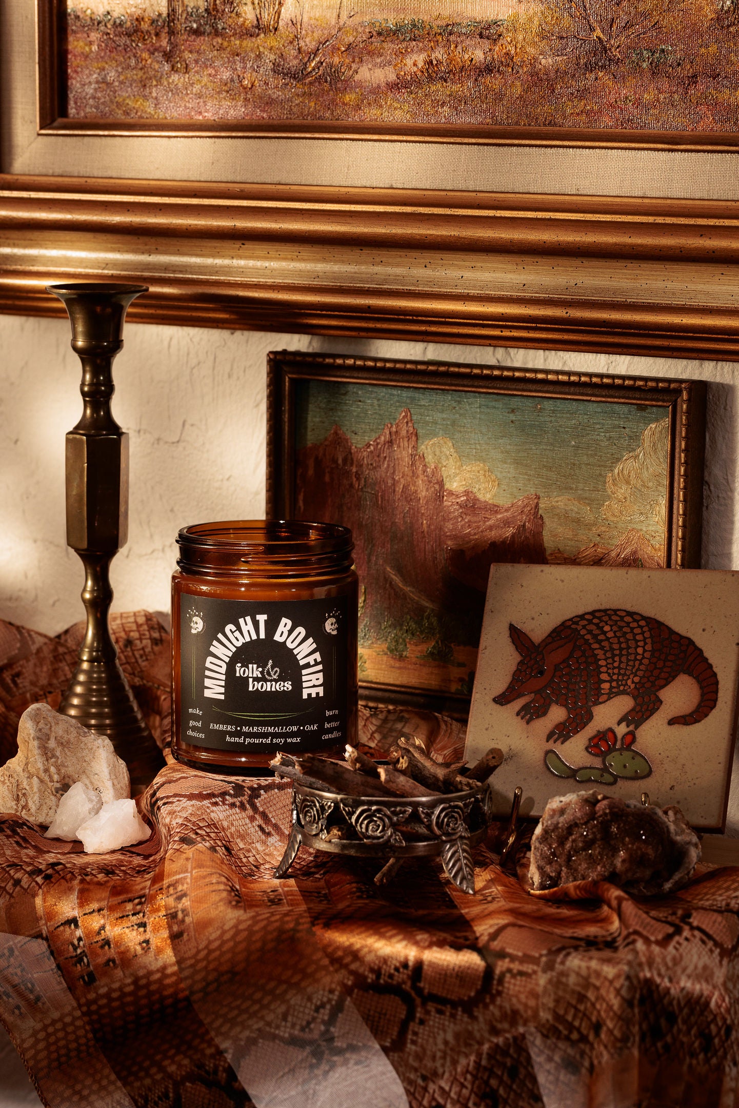 Folk and Bones Midnight Bonfire 8 oz soy candle with a dark jar and wooden wick, ideal for cozy ambiance.
