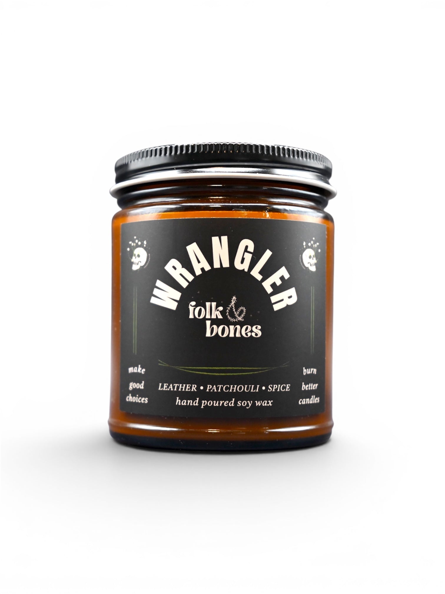 Wrangler Folk and Bones 8 oz soy candle in a glass jar with a wooden lid, featuring a rustic label and a lit wick.