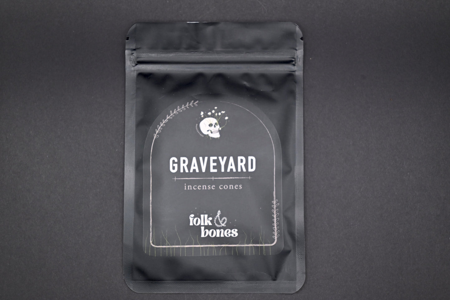 Folk and Bones Graveyard Incense Cones in a box, featuring dark, gothic-themed packaging with images of tombstones and spooky motifs.