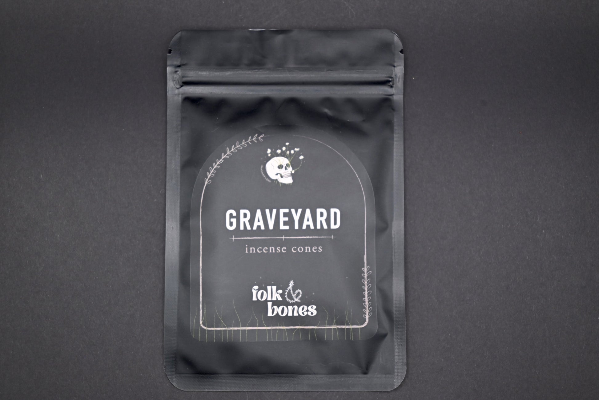 Folk and Bones Graveyard Incense Cones in a box, featuring dark, gothic-themed packaging with images of tombstones and spooky motifs.