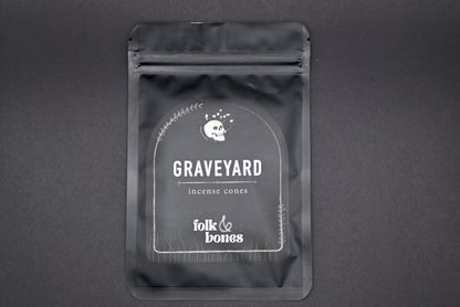 Folk and Bones Graveyard Incense Cones in a box, featuring dark, gothic-themed packaging with images of tombstones and spooky motifs.