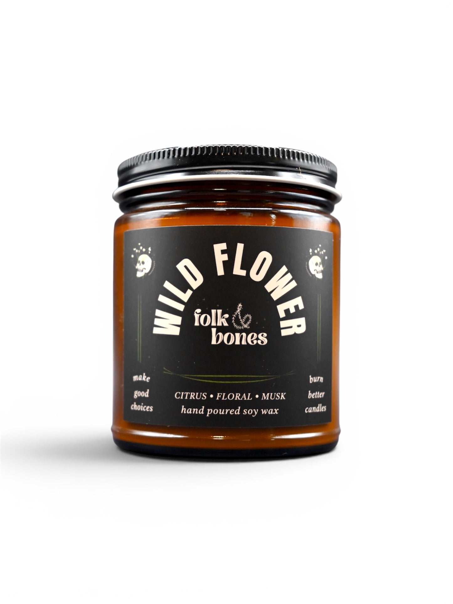 Folk and Bones Wild Flower 8 oz soy candle in a glass jar with a floral scent and a natural, rustic design.