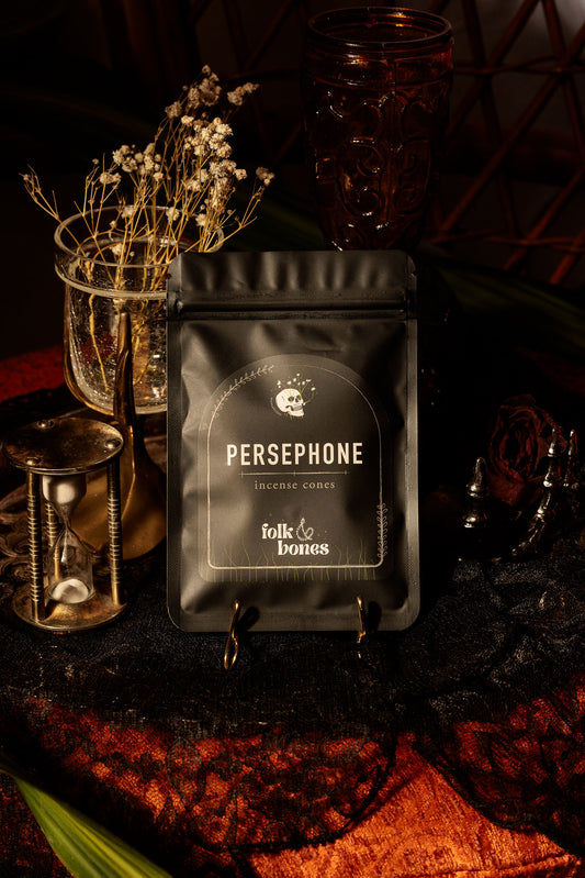 Folk and Bones Persephone incense cones in a decorative box, used for aromatic candle-burning and spiritual rituals.