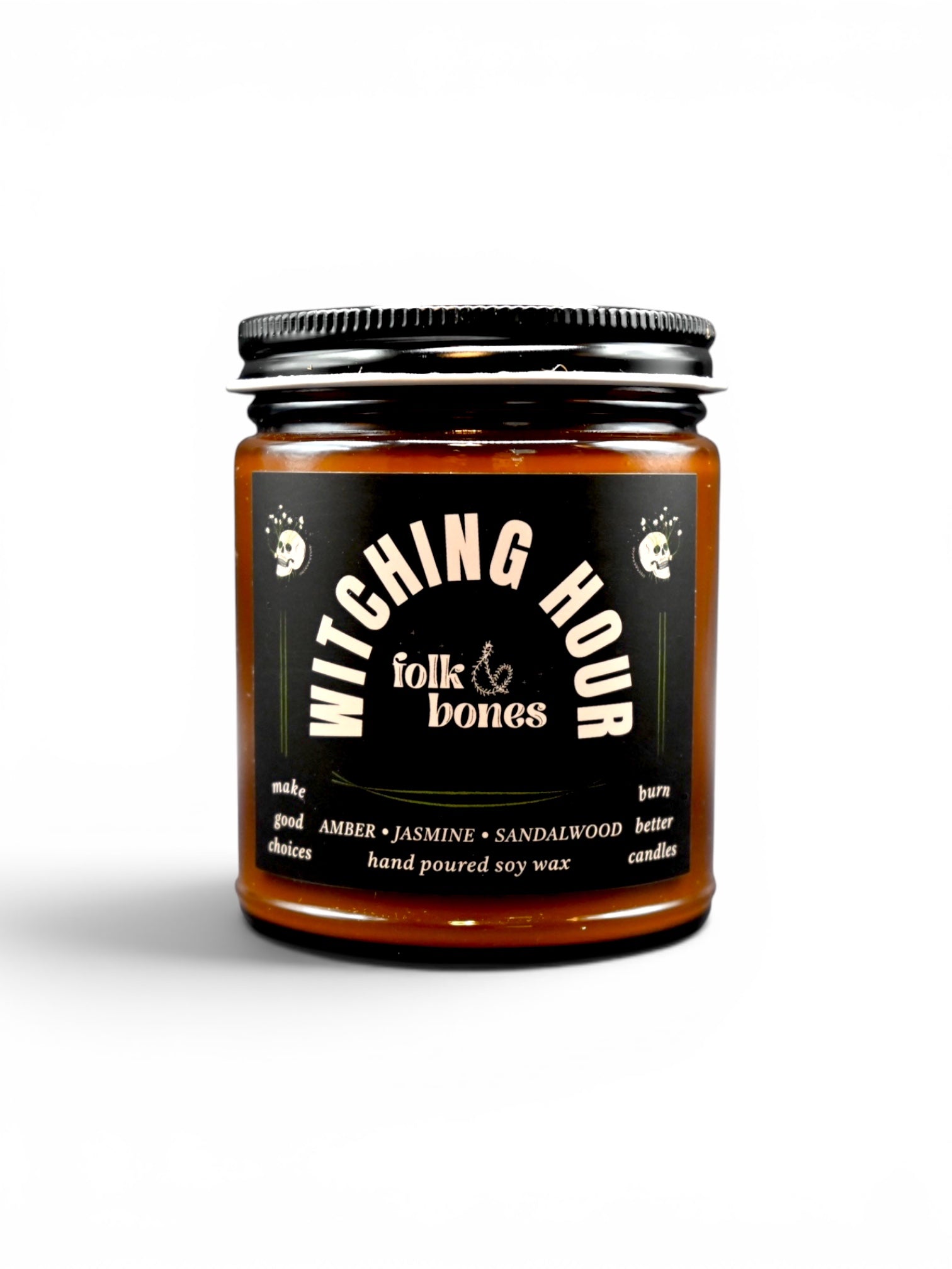 Folk and Bones Witching Hour 8oz soy candle in a dark jar with a black lid, featuring a mystical label and a lit wick.