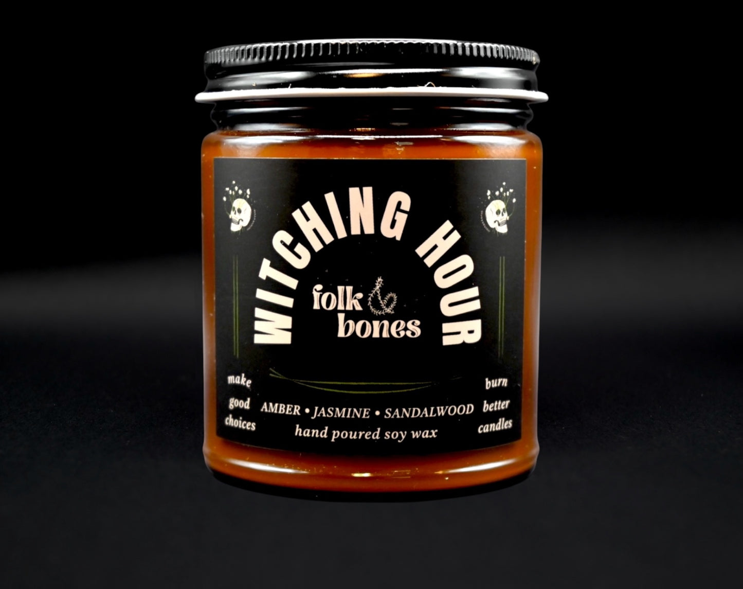 Folk and Bones Witching Hour 8oz soy candle in a dark jar with a black lid, featuring a mystical label design.