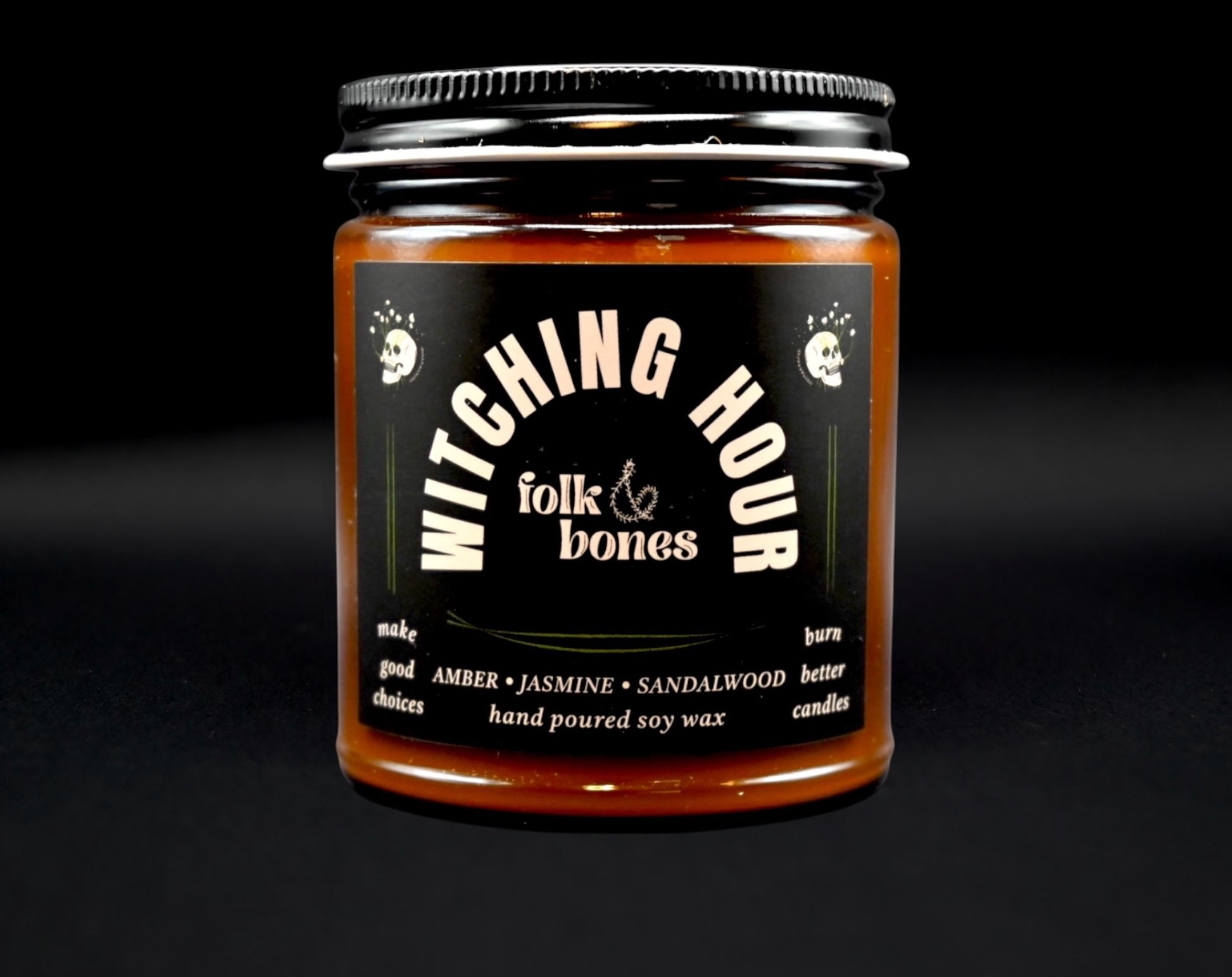 Folk and Bones Witching Hour 8oz soy candle in a dark jar with a black lid, featuring a mystical label design.