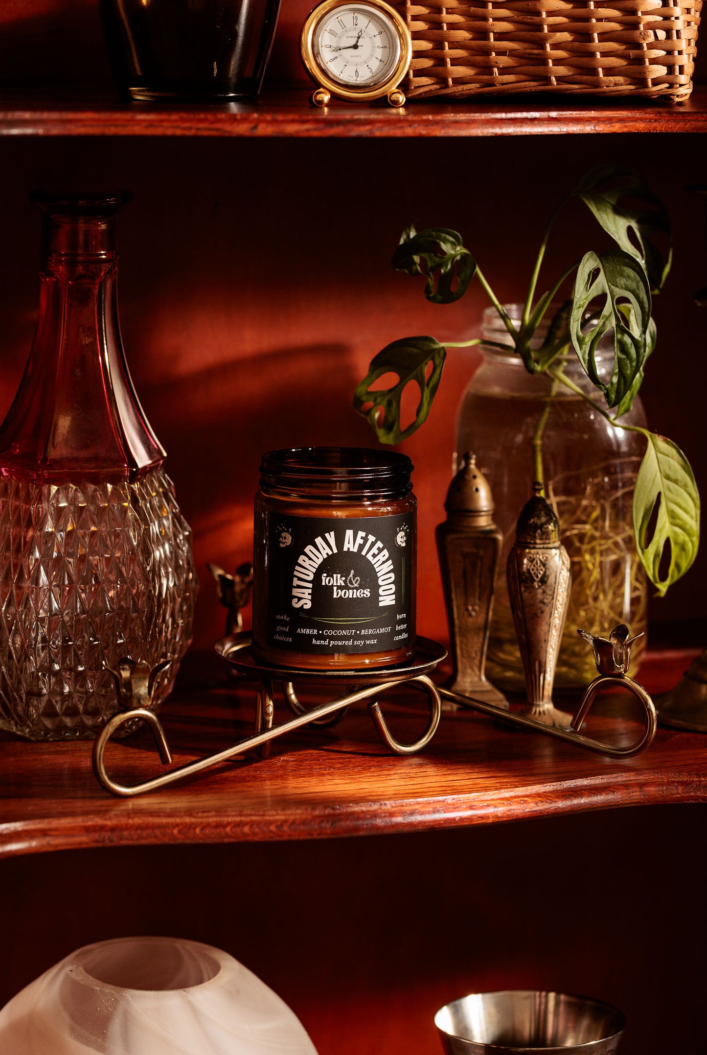 Folk and Bones Saturday Afternoon 8 oz soy candle in a glass jar with a white wick and a cozy, relaxing ambiance.