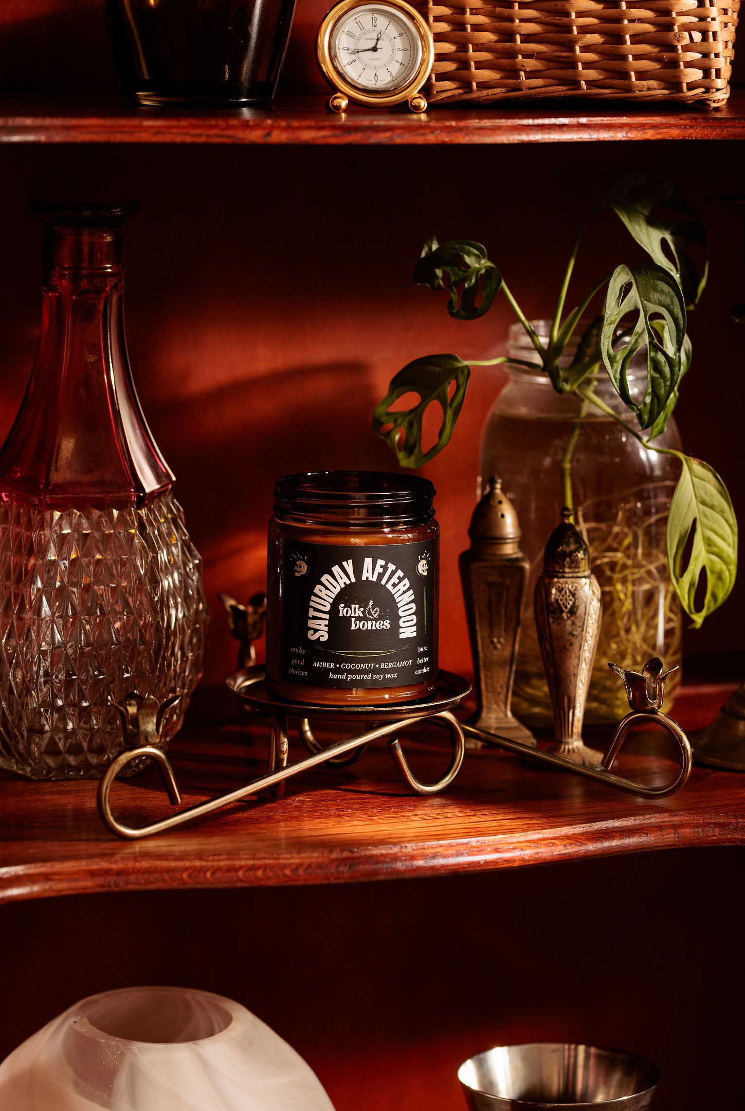 Folk and Bones Saturday Afternoon 8 oz soy candle in a glass jar with a white wick and a cozy, relaxing ambiance.