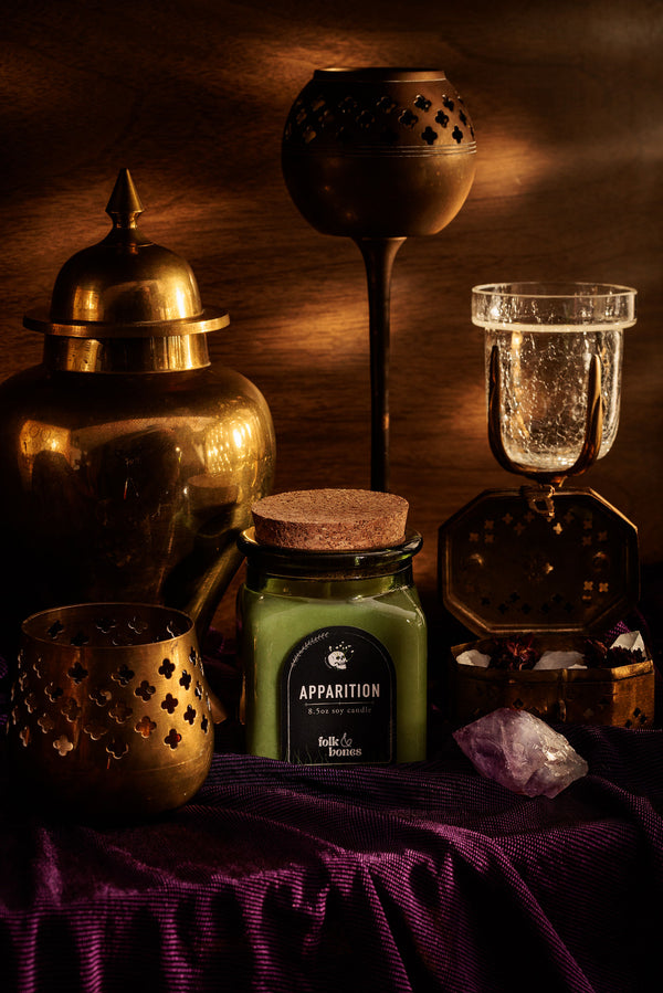 Folk and Bones Apparition 8 oz soy candle in a glass jar with a black lid, showing a minimalist label design.