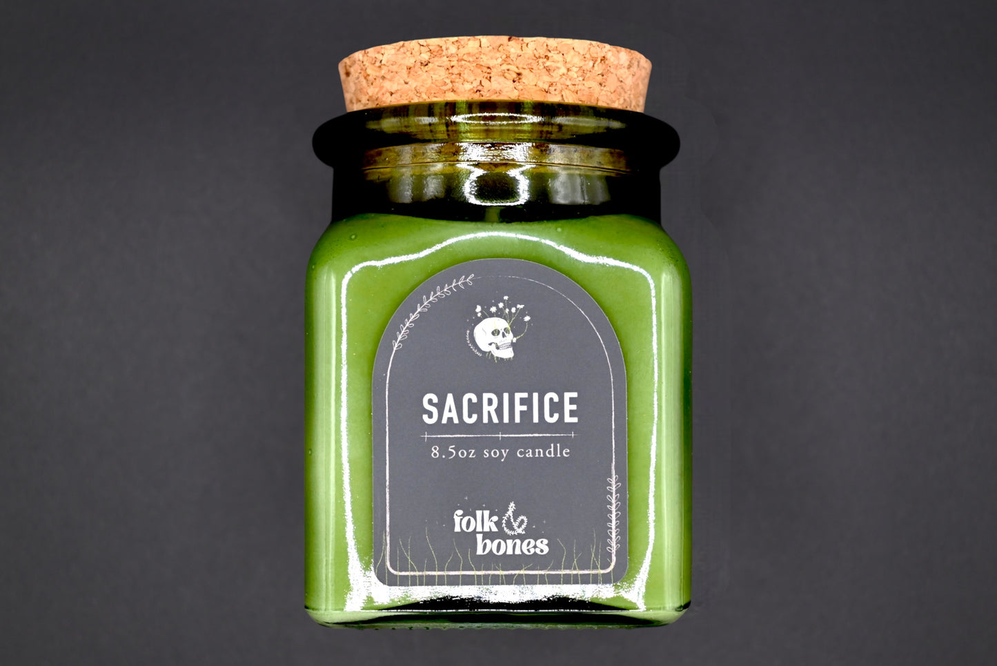 Folk and Bones Sacrifice 8 oz soy candle in a glass jar with a natural wax finish, ideal for home decor and aromatherapy.