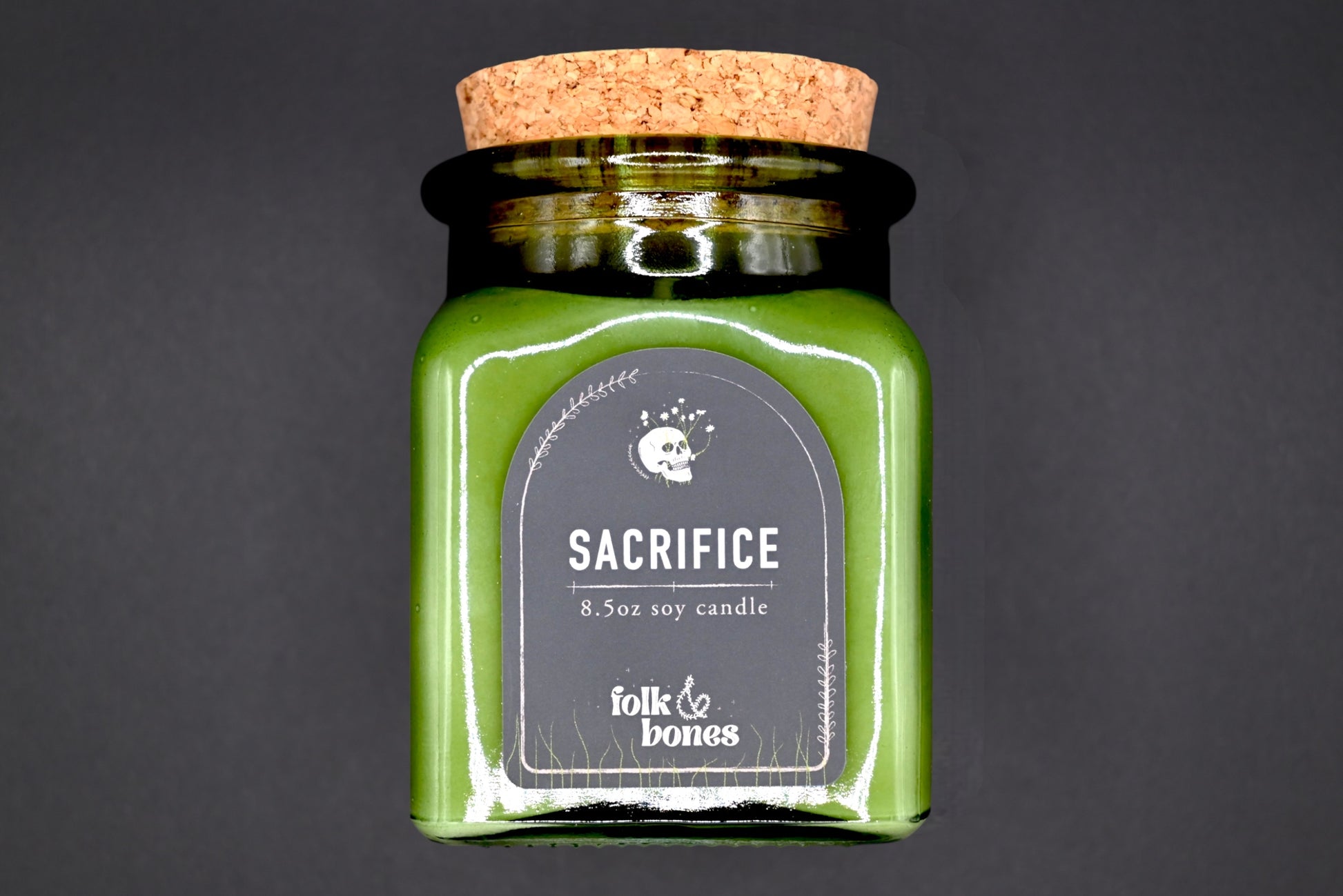 Folk and Bones Sacrifice 8 oz soy candle in a glass jar with a natural wax finish, ideal for home decor and aromatherapy.