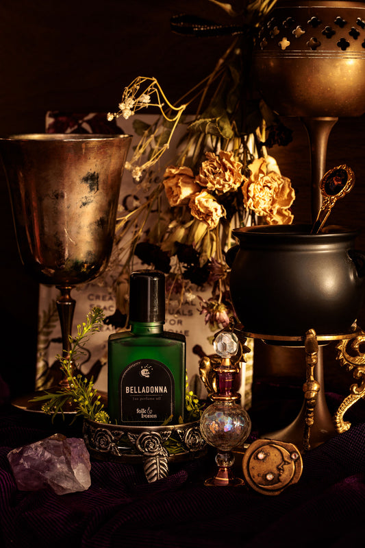 Folk and Bones Belladonna 1 oz perfume oil bottle with elegant label, displayed on a neutral background.