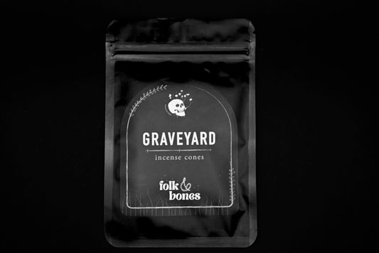 Folk and Bones Graveyard Incense Cones set with dark packaging and incense sticks for a gothic, aromatic candle experience.
