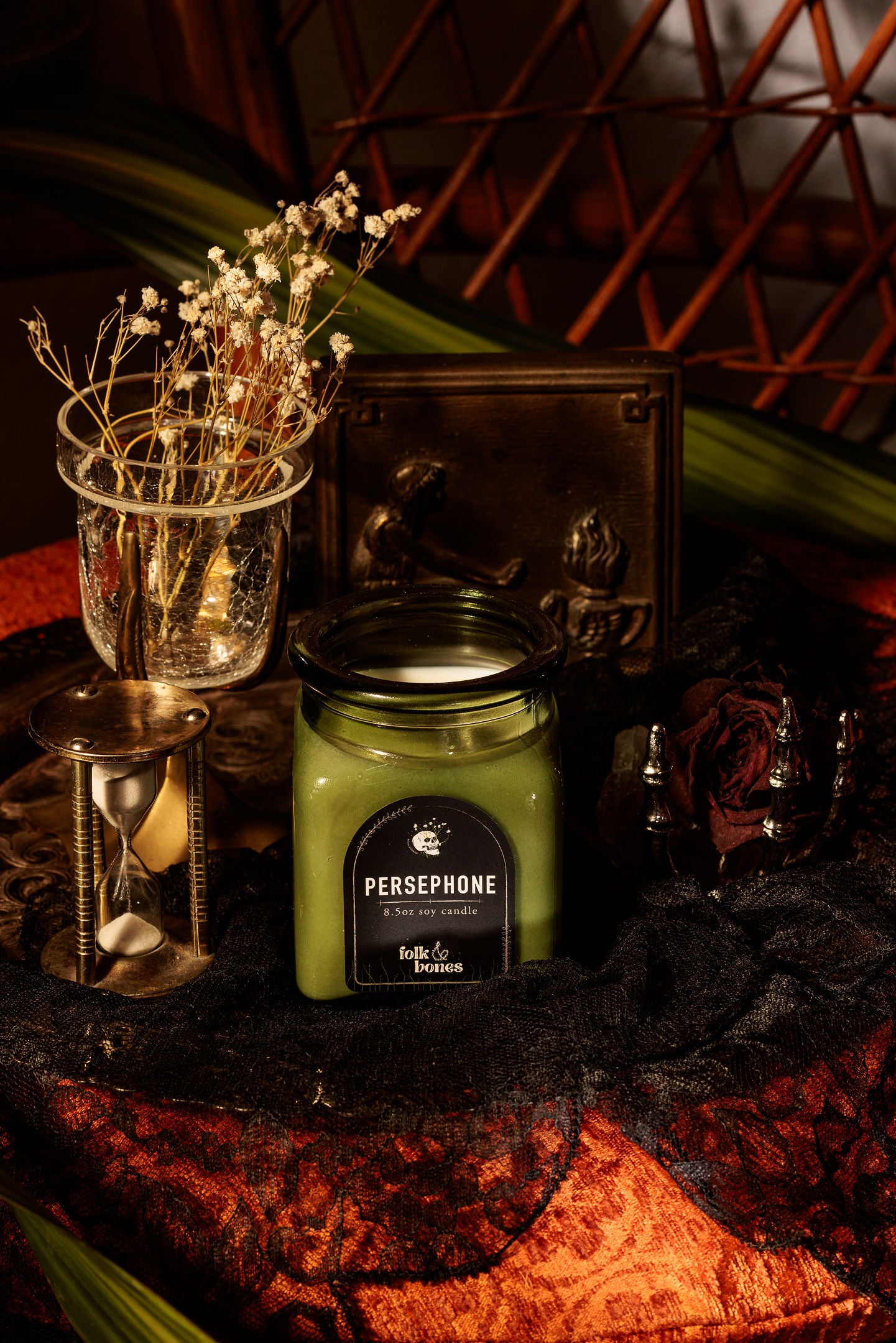 Persephone 8 oz soy candle by Folk and Bones, showing a white candle in a glass jar with a minimalist label design.