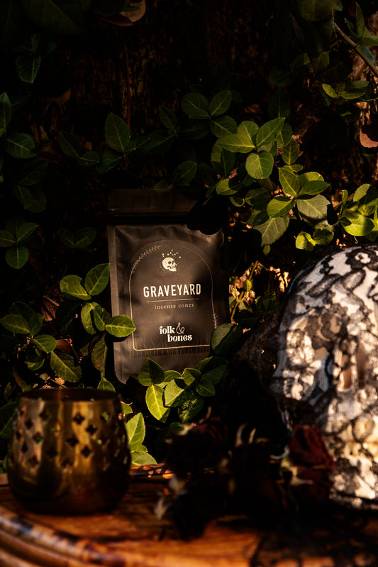 Folk and Bones Graveyard incense cone candles with dark packaging and intricate design, suitable for themed or gothic decor.